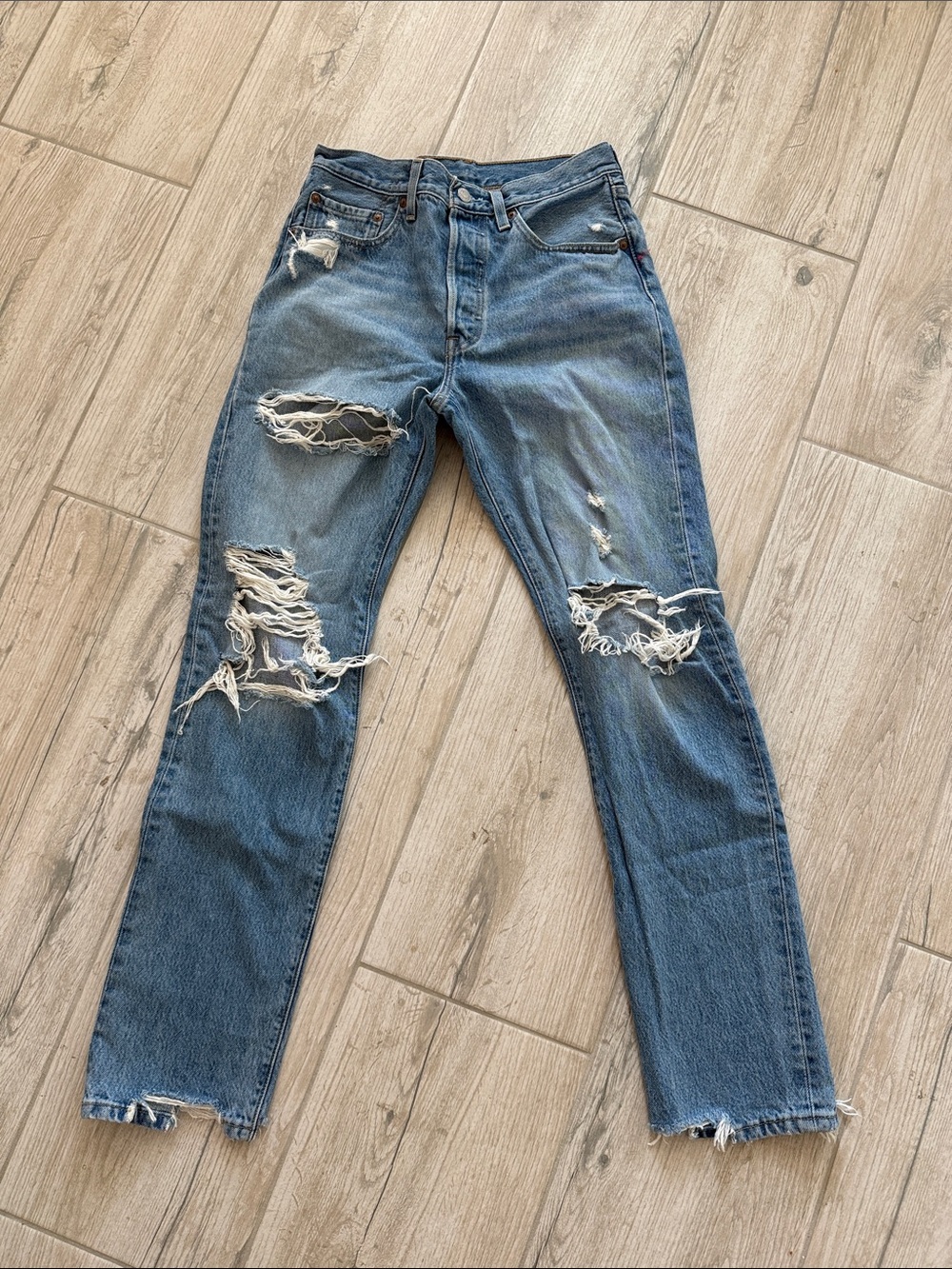 Distressed women’s Blue Ripped Jeans